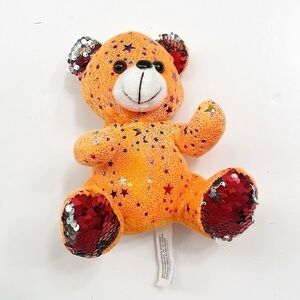 Orange star print bear stuffed animal